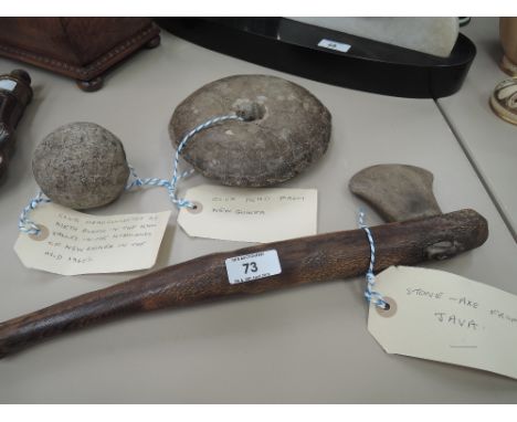 Two tribal club heads from Kuk Valley, New Guinea and a vintage stone-axe from Java