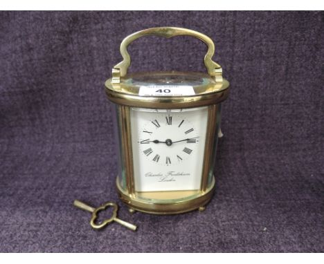A late 20th century brass frame carriage clock by Charles Frodsham, London, of traditional design