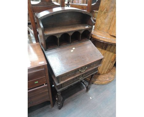 An 18th Century oak bible box lecturn having drawers with later additional arch shelf superstructure over and turned leg fram