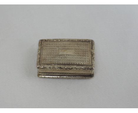 A Georgian silver vinaigrette having engine turned decoration, plain cartouche and moulded rims, gilt interior and pierced in
