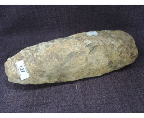 A stone flint of archelogical axe design