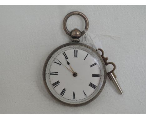 A Victorian white metal key wound pocket watch stamped fine silver  having a Roman numeral dial to white enamelled face in an