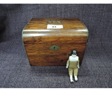 A late Victorian rosewood tea caddy having inlay script 'Tea' and a 19th century miniature porcelain doll