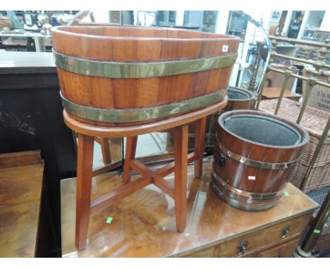 A vintage copper bound oak barrel, coal bucket with liner and a late 20th century brassed bound hardwood barrel planter