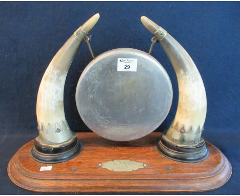 Early 20th Century presentation table gong, with cows horns and plated mounts on an oak stand marked 'M' 20th February 1930',