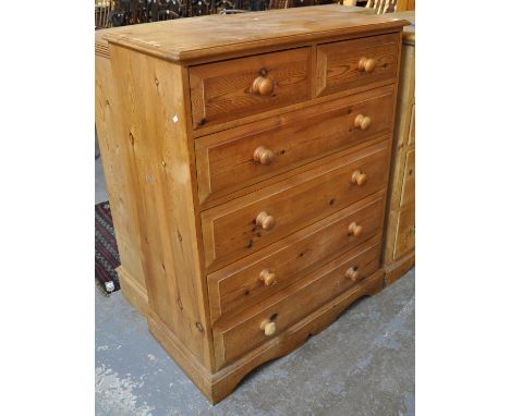 Modern pine straight front chest of two short and four long drawers with turned handles on bracket feet. (B.P. 21% + VAT) 