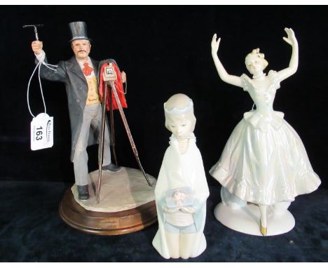 David Fisher, 1986 Saxony vintage style figure of a photographer, together with a Lladro Spanish porcelain figurine of a youn