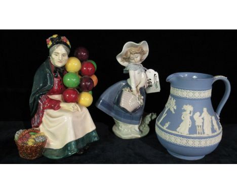 Royal Doulton bone china figurine The Old Balloon Seller HN1315, together with a Lladro Spanish porcelain figurine of a young