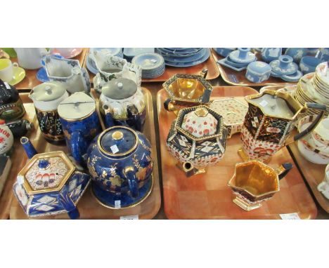 Tray of Imari design teaware to include teapot on stand, cream jug, sucriere, etc, together with another tray of pottery jugs