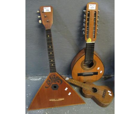 Fabrica de Guitarras Spanish 12 string acoustic guitar, together with a miniature 4 string acoustic guitar and a Russian Bala