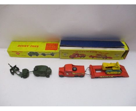 A Matchbox series diecast model vehicle king size Tractor and Transporter K8 boxed and a Dinky Toys diecast model 25-Pounder 