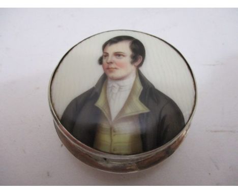 A silver and enamelled pill box by A J Pepper & Co, Birmingham 1914, the detachable lid decorated with a portrait of a gentle