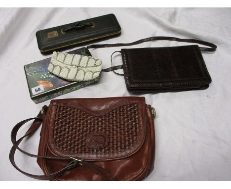 A vintage crocodile shoulder bag with detachable straps, an early 20th century beaded evening bag, an accordion style bag and