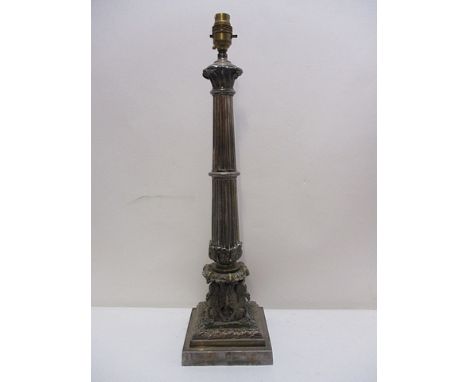 A late Victorian, silver plated lamp base having a fluted and reeded column, supported by four birds within a wreath on a ste