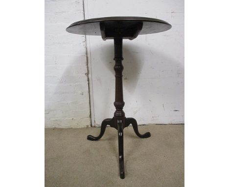 A George III mahogany pedestal table  having a tip top, over a knopped column, raised on tripod base, 29 h, 22 dia