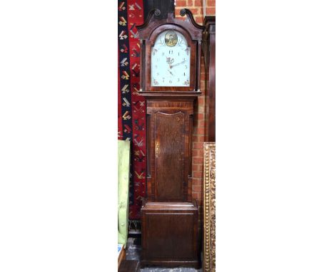 A Victorian mahogany and oak longcase clock, the eight-day twin train movement with arched painted dial, having subsidiary se