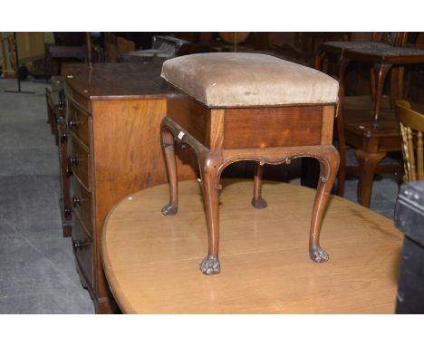 A George ll style mahogany piano stool on hairy paw feet. 