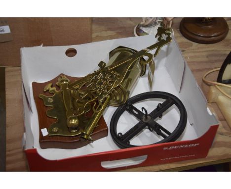 A brass rotating spit complete with wall bracket and pulley. 