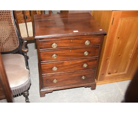 A 19th Century mahogany chest of four graduated drawers each applied with brass ring handles. 