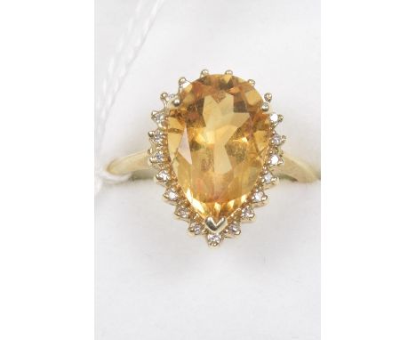 A 9ct gold citrine and diamond cluster ringThe pear shape citrine within a single cut diamond surround, hallmarks for Birming