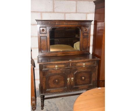 A 1920's oak mirror back sideboard on bobbin turned supports. 
