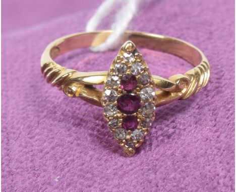 An early 20th century ruby and diamond cluster ringThe cushion shape ruby line within an old cut diamond navette shape surrou