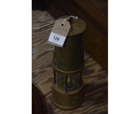A Protector Lamp and Lighting Company Ltd brass miners lamp. 