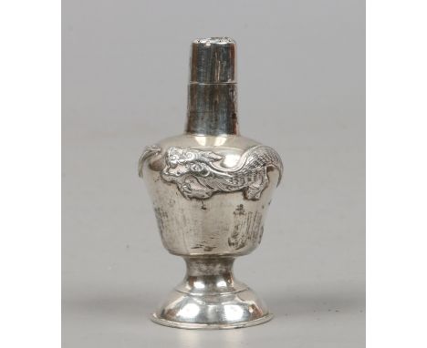 A Chinese silver pepperette with dragon decoration 