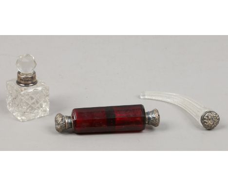 A Victorian ruby glass double ended scent bottle, a horn shaped example and a silver rimmed cut glass inkwell.