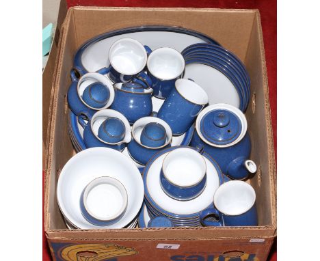 A box of Denby stoneware tea/dinner service decorated in a blue glaze.