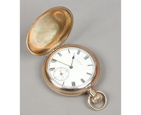 A rolled gold Elgin full hunter pocket watch. With enamel dial and subsidiary seconds. Condition Report. To be used as a guid