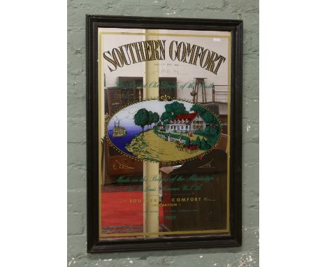 A framed Southern Comfort advertising mirror.
