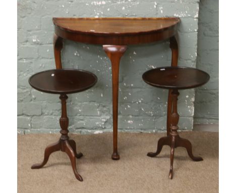 A demi lune hall table and a pair of tripod wine tables.