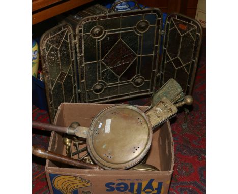 A brass and stained glass fire screen along with bedwarmers, bellows, companion set etc.