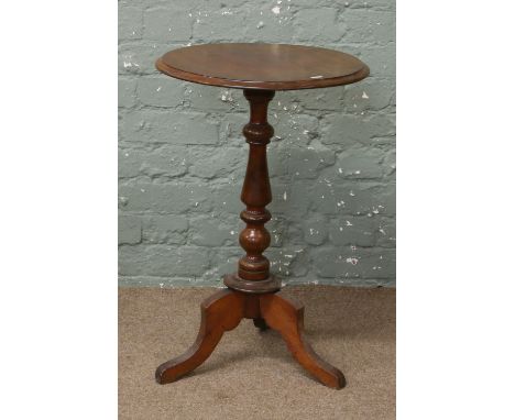 A Victorian mahogany tripod table.