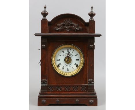 A Victorian oak Fattorini & Sons alarm clock.