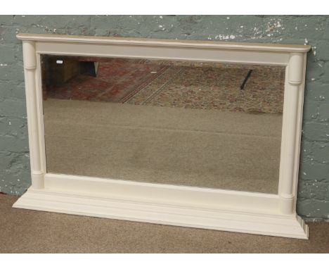 A painted over mantel mirror with bevel edge glass.