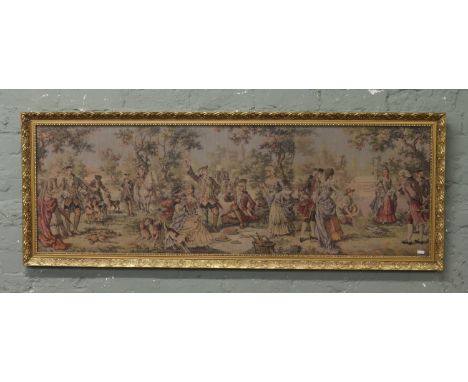 A gilt framed tapestry depicting figures in 18th Century dress 