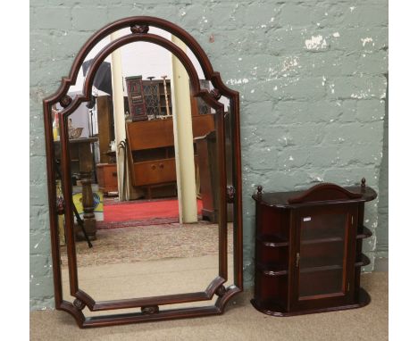 A mahogany dome top mirror and wall mounted display cabinet.