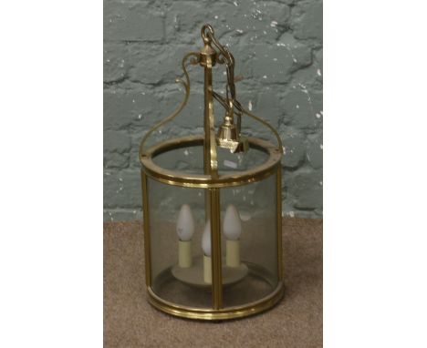 A brass cylindrical hall lantern.