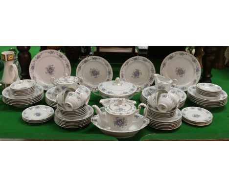 A Noritake bone china tea/dinner service decorated in the the Violette pattern including plates, side plates, cups and saucer