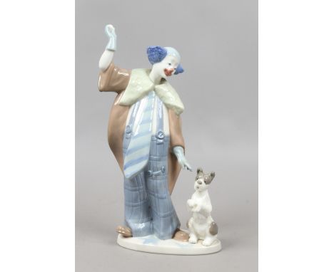 A boxed Nao figure of a clown and dog.