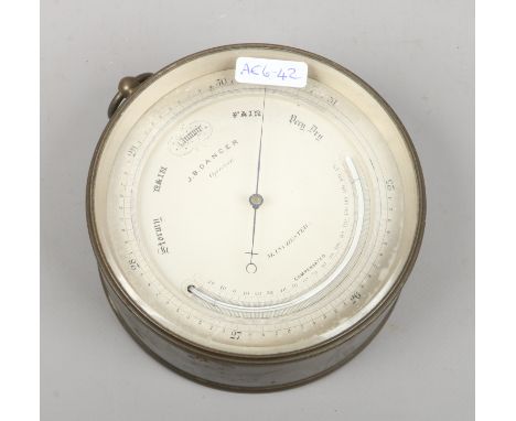 A brass cased hanging barometer by J B Dancer optician Manchester