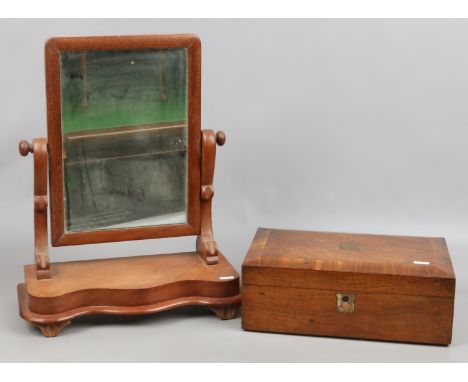 A Victorian walnut fitted writing slope and a mahogany toilet mirror.