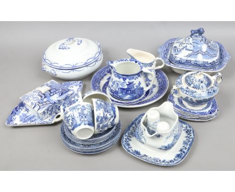 A quantity of various blue and white tea/dinner wares mostly decorated with Willow pattern including tureens, cups and saucer