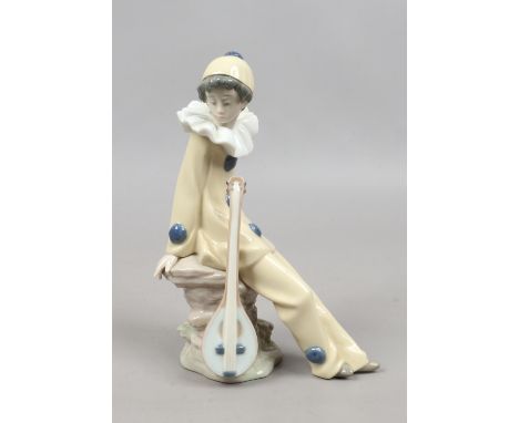 A boxed Nao figure of a boy dressed as a clown.