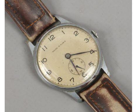 A gentlemans manual wristwatch with champagne dial, Arabic numeral markers and subsidiary seconds. Condition Report. To be us