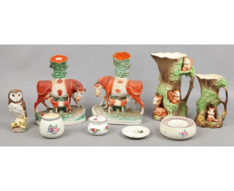 A quantity of collectable ceramics including Staffordshire spill vases (one with restoration) Poole, Royal Doulton, model of 