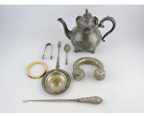 A late Victorian silver-handled button hook, a George V silver preserve spoon, a pair of silver sugar tongs, a plated pickle 