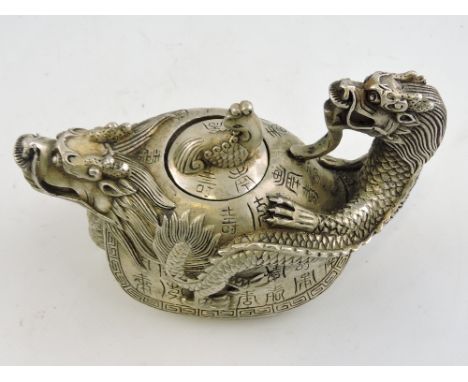 A white metal teapot in the form of a tortoise, with a dragon head spout and handle, H. 9cm.